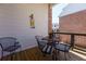 The cozy balcony features a wrought iron table and chairs, perfect for enjoying outdoor moments in a private setting at 451 Burton Dr # 32, Alpharetta, GA 30009