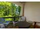 Cozy balcony with wooded view and seating at 451 Burton Dr # 32, Alpharetta, GA 30009