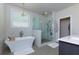 Luxurious bathroom with a soaking tub and a separate glass-enclosed shower at 451 Burton Dr # 32, Alpharetta, GA 30009