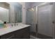 Bathroom featuring a glass enclosed shower, chrome fixtures, and a white countertop at 451 Burton Dr # 32, Alpharetta, GA 30009