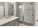 Modern bathroom with a glass-enclosed shower and sleek vanity with quartz countertop at 451 Burton Dr # 32, Alpharetta, GA 30009