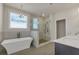 Bathroom featuring a modern soaking tub, a glass-enclosed shower, and elegant finishes creating a luxurious feel at 451 Burton Dr # 32, Alpharetta, GA 30009