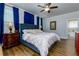 Primary bedroom features wood floors, blue accents and ample natural light at 451 Burton Dr # 32, Alpharetta, GA 30009