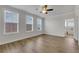 Spacious bedroom featuring hardwood flooring and multiple bright, natural-light-filled windows at 451 Burton Dr # 32, Alpharetta, GA 30009