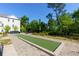 Spend time on the community bocce ball court with sidewalks, landscaping, and views of the surrounding property at 451 Burton Dr # 32, Alpharetta, GA 30009