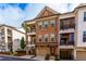 Beautiful brick townhome boasting a two-story design and dual balconies for relaxing outdoor living at 451 Burton Dr # 32, Alpharetta, GA 30009