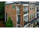 A beautiful brick townhouse featuring a two-story layout and inviting balconies at 451 Burton Dr # 32, Alpharetta, GA 30009