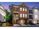 Charming brick townhome featuring a two-story facade and two balconies perfect for outdoor enjoyment at 451 Burton Dr # 32, Alpharetta, GA 30009