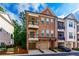 Charming brick townhome featuring a two-story facade and two balconies perfect for outdoor enjoyment at 451 Burton Dr # 32, Alpharetta, GA 30009