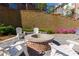 Gather around the cozy fire pit with white Adirondack chairs, creating a welcoming outdoor space at 451 Burton Dr # 32, Alpharetta, GA 30009