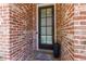 Up-close brick view of the main entrance and custom door mat at 451 Burton Dr # 32, Alpharetta, GA 30009