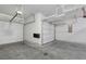 Interior garage showing white walls, finished floor and storage racks for organization and space at 451 Burton Dr # 32, Alpharetta, GA 30009
