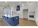 Modern kitchen featuring white cabinets, a large island, and stainless steel appliances at 451 Burton Dr # 32, Alpharetta, GA 30009