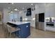 Bright, open kitchen features white cabinetry, stainless steel appliances, a center island with seating, and recessed lighting at 451 Burton Dr # 32, Alpharetta, GA 30009