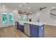 Kitchen with island sink, stainless steel appliances, and open layout to the living area at 451 Burton Dr # 32, Alpharetta, GA 30009