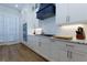 The kitchen has sleek white countertops, stainless steel appliances, and ample cabinet space, perfect for culinary enthusiasts at 451 Burton Dr # 32, Alpharetta, GA 30009