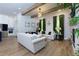 Bright and open living room featuring modern decor, comfortable seating, hardwood floors, and ample natural light at 451 Burton Dr # 32, Alpharetta, GA 30009