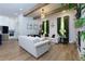 Bright open-concept living space features hardwood floors, beamed ceilings, and modern decor at 451 Burton Dr # 32, Alpharetta, GA 30009