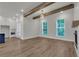 Open floor plan features wood floors, fireplace, and white trim and paint with cabinetry at 451 Burton Dr # 32, Alpharetta, GA 30009