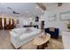 Spacious living area with hardwood floors seamlessly connects to the kitchen and dining space at 451 Burton Dr # 32, Alpharetta, GA 30009