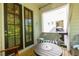 Inviting patio space with wicker furniture, a round table, and views of the surrounding area at 451 Burton Dr # 32, Alpharetta, GA 30009