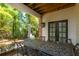 Covered patio with outdoor dining set, perfect for entertaining and relaxation at 451 Burton Dr # 32, Alpharetta, GA 30009