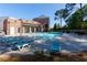 Community pool featuring sun loungers for relaxing and enjoying sunny days at 451 Burton Dr # 32, Alpharetta, GA 30009
