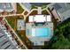 Aerial view of a community pool surrounded by lounge chairs and lush landscaping at 451 Burton Dr # 32, Alpharetta, GA 30009