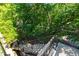 Outdoor stairs lead down with views of greenery and nature at 451 Burton Dr # 32, Alpharetta, GA 30009