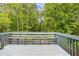 Wooden back deck overlooking lush greenery, perfect for outdoor relaxation and enjoying the natural surroundings at 4849 Chapelle Ct, Marietta, GA 30066