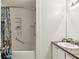 Bright bathroom featuring a tub and shower combo with custom shower curtain and built-in shelving at 4849 Chapelle Ct, Marietta, GA 30066