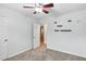 Bedroom with floating shelves, carpet, and a door to the hallway at 4849 Chapelle Ct, Marietta, GA 30066
