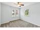 Bedroom with two windows providing natural light and a ceiling fan at 4849 Chapelle Ct, Marietta, GA 30066