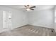 This cozy bedroom has soft carpet, light blue walls, and a ceiling fan at 4849 Chapelle Ct, Marietta, GA 30066