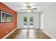 Dining area with hardwood floors and glass doors that open to a deck, creating a bright and airy space at 4849 Chapelle Ct, Marietta, GA 30066