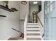 Bright entryway featuring a staircase, skylight, and hardwood floors, creating an inviting and modern entrance to the home at 4849 Chapelle Ct, Marietta, GA 30066