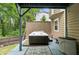 Back deck with a hot tub and privacy screen, perfect for relaxation and entertainment at 4849 Chapelle Ct, Marietta, GA 30066