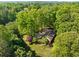 Lovely wooded home with mature landscaping, a patio and a long driveway at 659 Pleasant Hill Nw Rd, Conyers, GA 30012