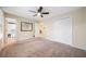 Neutral bedroom with closet, ceiling fan and view of the ensuite bath at 659 Pleasant Hill Nw Rd, Conyers, GA 30012