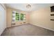 Comfortable bedroom featuring neutral tones, a large window, and a closet at 659 Pleasant Hill Nw Rd, Conyers, GA 30012