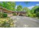 Charming single-story brick home with an attached garage, well-manicured lawn, and plenty of parking space at 659 Pleasant Hill Nw Rd, Conyers, GA 30012