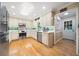 Bright kitchen with stainless steel appliances, light wood cabinets, and hardwood floors for a modern and functional space at 659 Pleasant Hill Nw Rd, Conyers, GA 30012