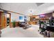 Expansive living room area with a vintage brick fireplace, wood paneled walls, and unique décor at 659 Pleasant Hill Nw Rd, Conyers, GA 30012