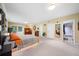 Sunlit main bedroom offering a closet, direct bath access, and views of the wooded property at 659 Pleasant Hill Nw Rd, Conyers, GA 30012