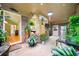 Bright sunroom filled with lush plants, brick accents, and a view to the home's interior at 659 Pleasant Hill Nw Rd, Conyers, GA 30012