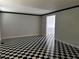 Bright room featuring black and white checkered floors and neutral walls for a modern touch at 150 N Pond Ct, Roswell, GA 30076
