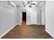 Charming bedroom features ceiling fan, wood-look flooring, gray walls and white wood accents at 3458 Cooper St, Lithia Springs, GA 30122