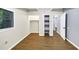 Bright bedroom with wood-look flooring, closet, and doorway offers ample storage and versatile layout options at 3458 Cooper St, Lithia Springs, GA 30122