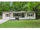Charming renovated single-story home featuring updated landscaping, fresh exterior paint, and modern accents at 3458 Cooper St, Lithia Springs, GA 30122