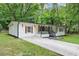 Attractive single-story home with a well-maintained lawn and a covered front porch at 3458 Cooper St, Lithia Springs, GA 30122